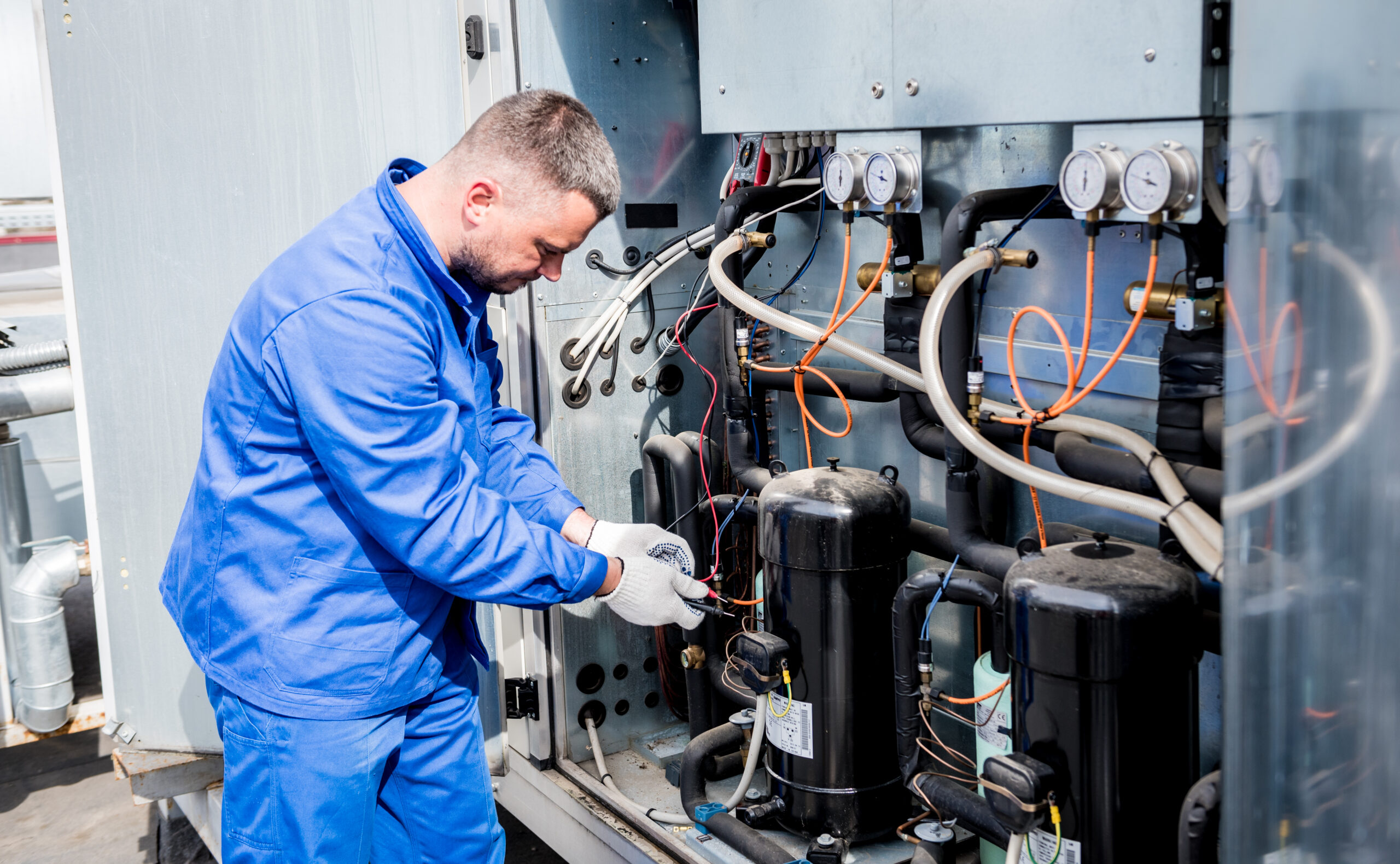 technician performing maintenance on a facility asset